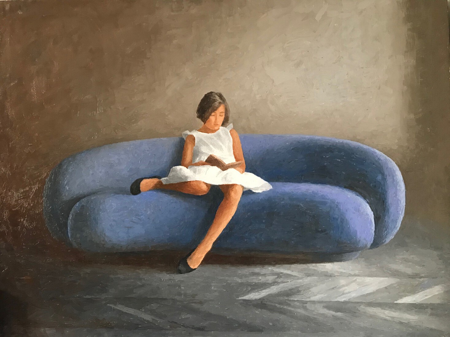 girl on a curved sofa