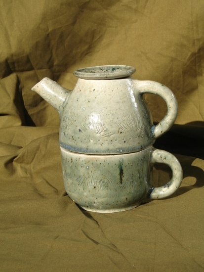 Teapot with cup