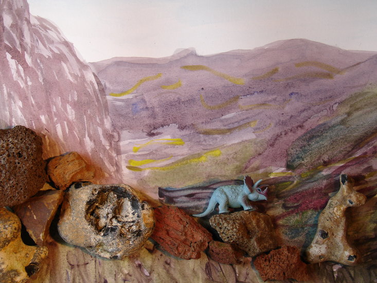 rock-strewn landscape with dinosaue