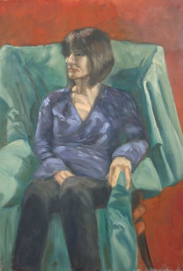 Zittende vrouw in groene stoel