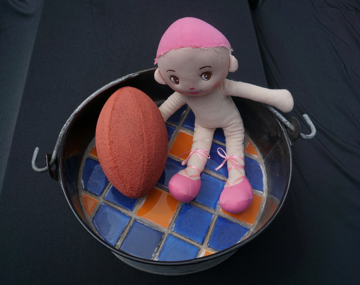 Child in bath with ball