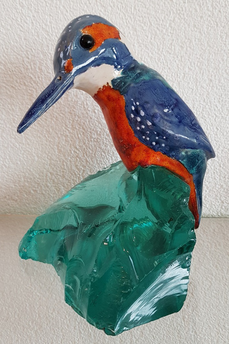 IJsvogeltje op turquoise glas