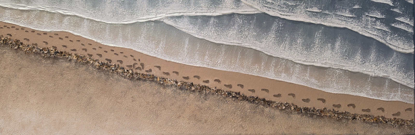 Voetstappen in het zand