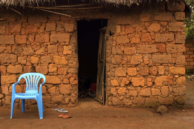 Blue chair against red wall - Angola