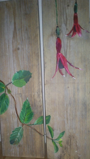 Beschilderde steigerhouten planken.