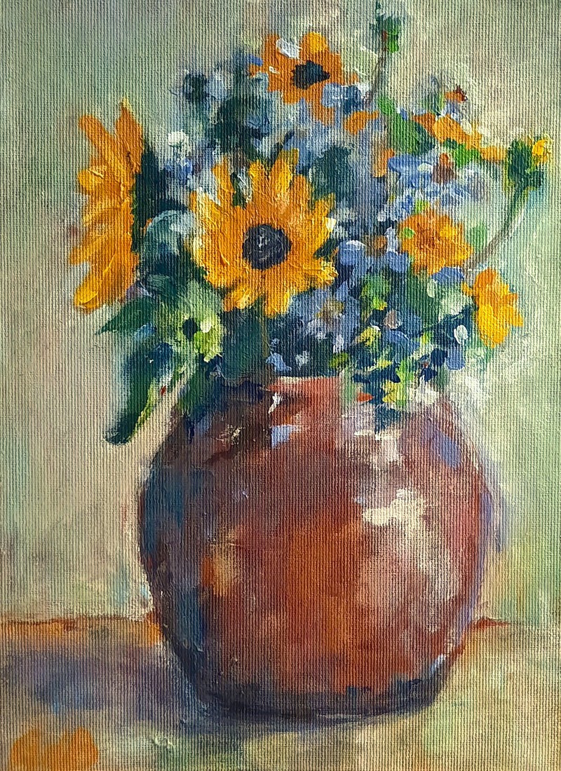 Pot met herfstbloemen 