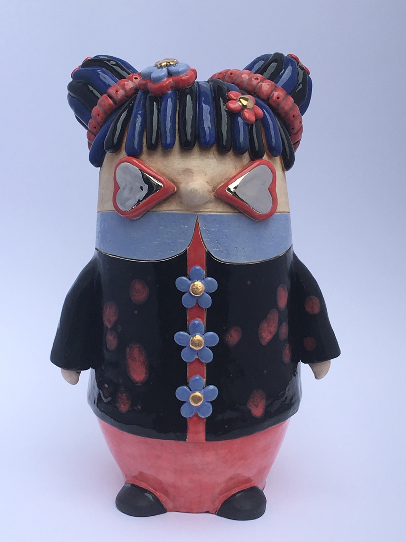 Blauw/zwart knotmeisje