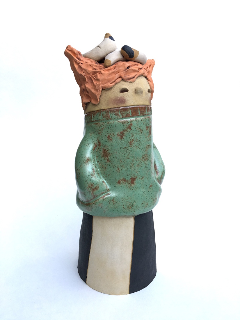 Girl with green shirt and cat