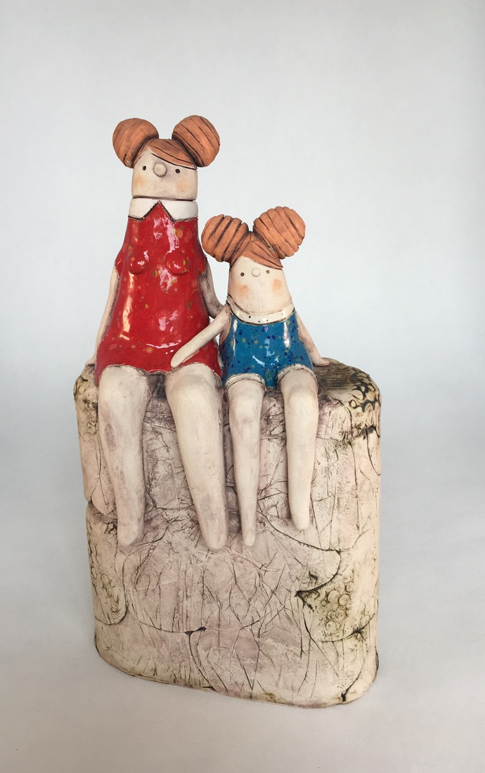 Mother and child on stone