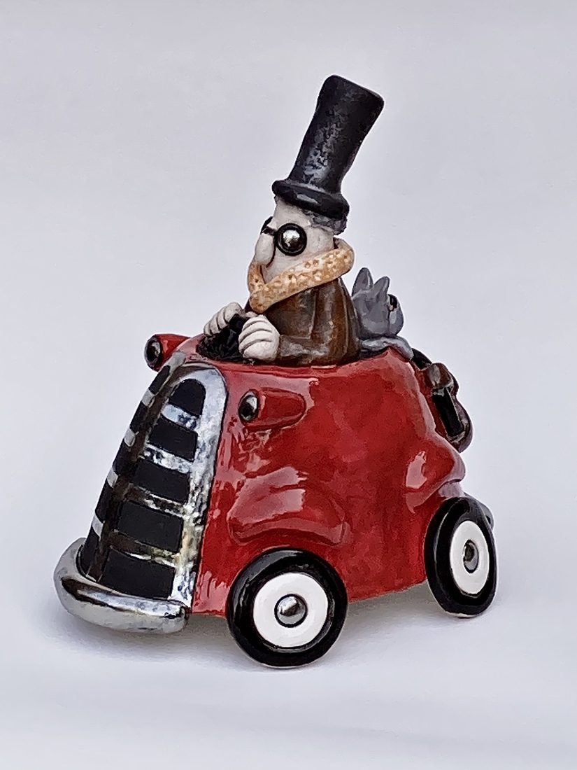 Rood autootje met hondje 