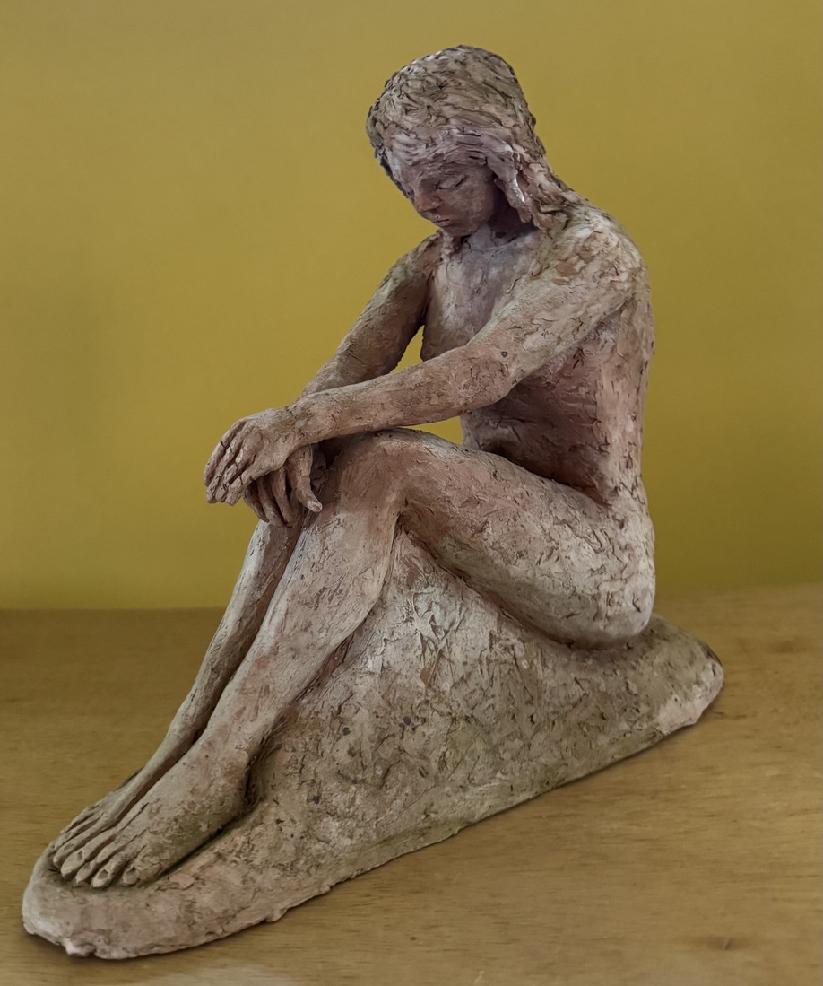 Zittende vrouw