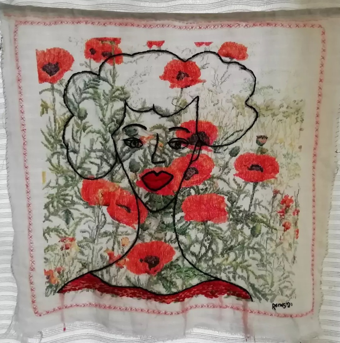 selfportrait on embroidered poppys by my late auntie Greet