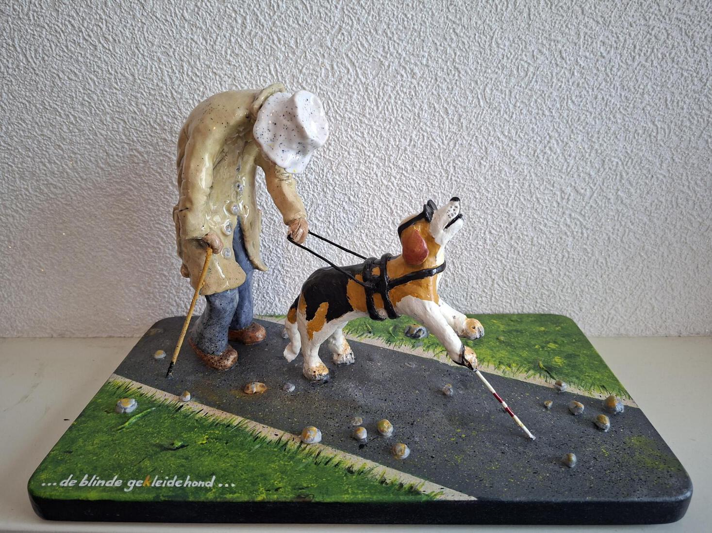 De blinde geKleidehond ....