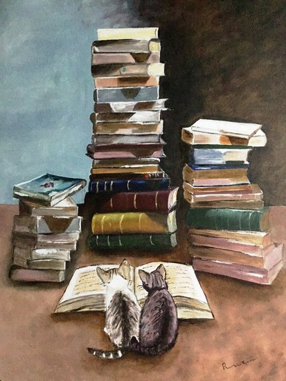 Twee poesjes lezen een boek