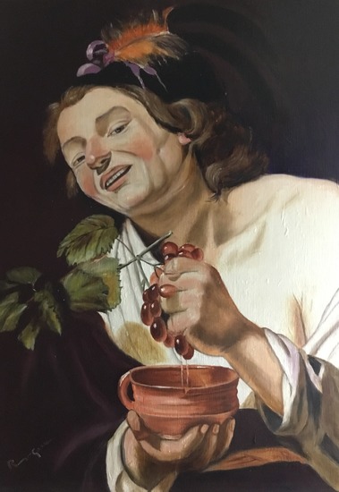 Smiling young man squeezing grapes