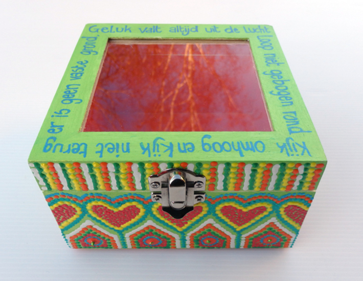 green wooden box with glass lid