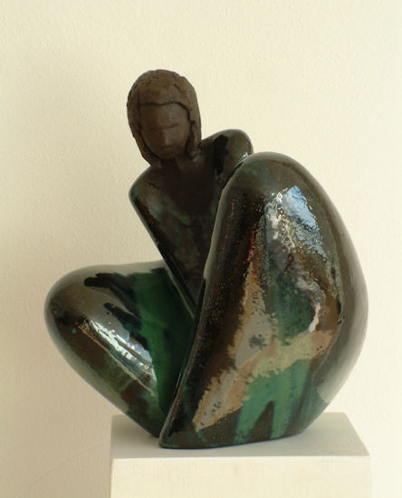 sitting in dark green