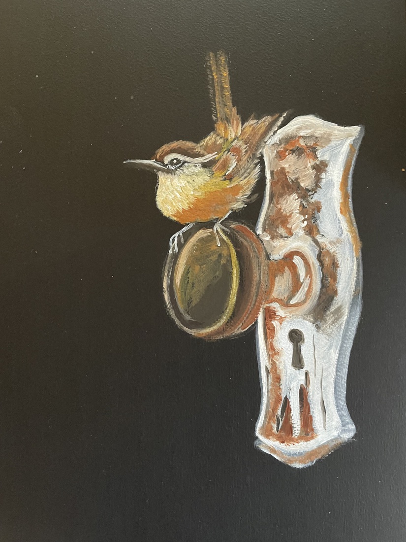 Winterkoninkje op deurknop