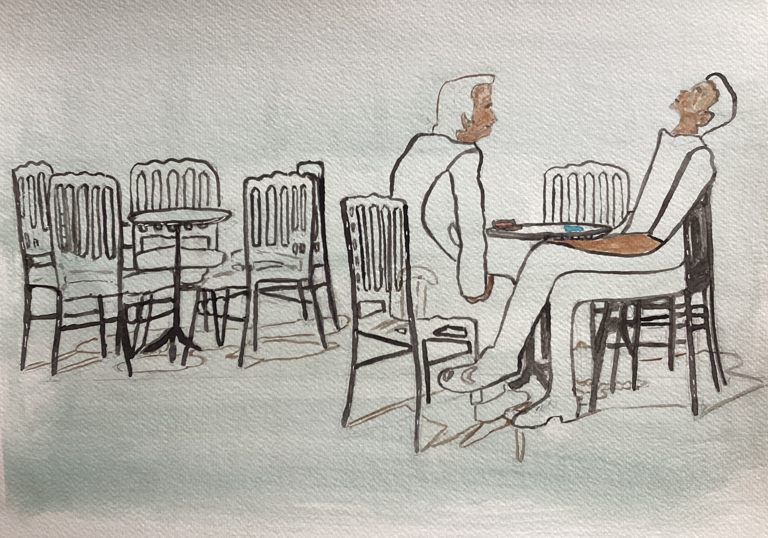 Zittende mannen op daktarras