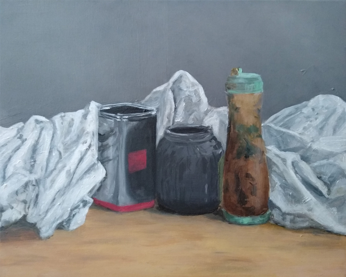 Tin jar, bottle, and cloth